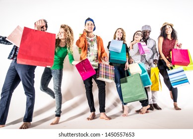 Multi-ethnic Group Of People Holding Colored Shopping Bags And Laughing - Portrait Of Funny Friends Posing On White Background