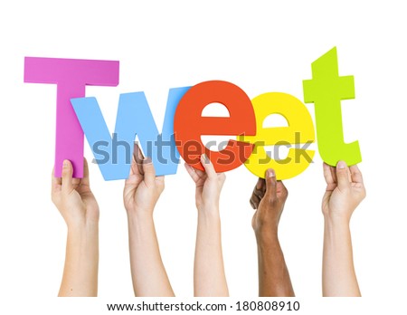 Multi-Ethnic Group Of People Holding The Word Tweet