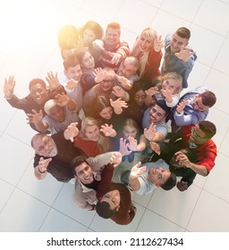 Multiethnic Group Of People Standing Together With Hands Up