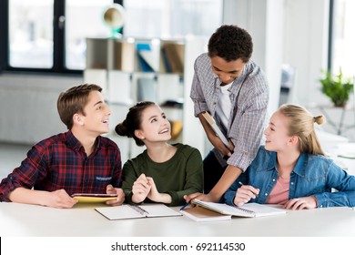 Multiethnic Group Teenagers Doing Homework Together Stock Photo ...