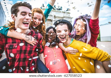 Multi-ethnic group of teens bonding outdoors