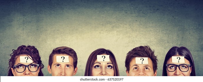 Multiethnic group of thinking people with question mark looking up