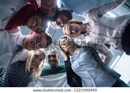 Similar – Multiethnic friends resting outside food truck in evening