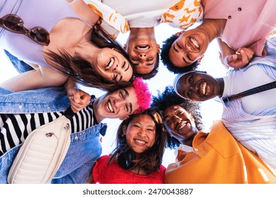 Multiethnic group of young happy friends hanging out in the city - Multiracial group of students meeting and having fun outdoors, concepts about youth, teenage, diversity and lifestyle - Powered by Shutterstock