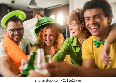 Multiethnic Group Of Young People Having Fun And Drinking Beer Together. Ireland National Symbols. St Patricks Day.