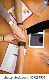 Multiethnic hands together team unity concept 
