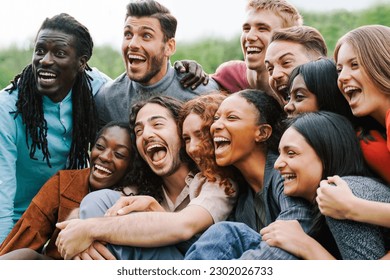 Multiethnic happy group of people having fun outdoor - Focus on center African girl - Shutterstock ID 2302026733