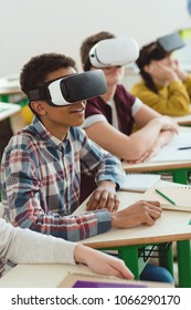 Multiethnic High School Students Using Virtual Reality Headsets In Classroom