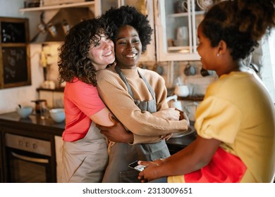 Multiethnic homosexual female lesbian couple with daughter spending time together at home - Powered by Shutterstock