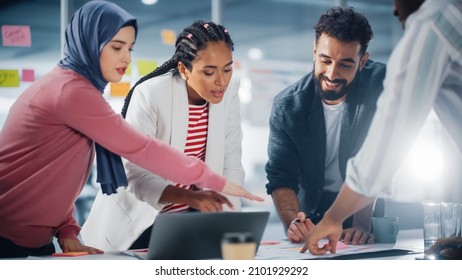 Multi-Ethnic Office Conference Room Businesspeople Meeting at Big Table. Diverse Team of Creative Entrepreneurs Talk, Find Solution. Specialists work in Digital e-Commerce Startup. - Powered by Shutterstock