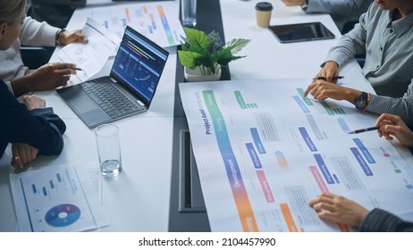 Multi-Ethnic Office Conference Room Businesspeople Meeting at Big Table. Diverse Team of Creative Entrepreneurs Talk, Find Solution. Specialists work in Digital e-Commerce Startup. Focus on Hands - Shutterstock ID 2104457990