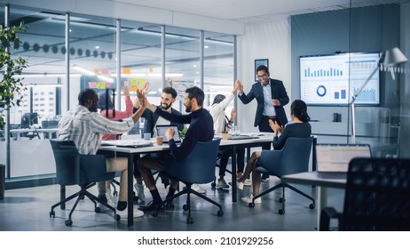 Multi-Ethnic Office Conference Room. Executive does Presentation for Young Managers. Team of Businesspeople Applaud, Celebrate Victorious Start of the Innovative e-Commerce Startup. - Powered by Shutterstock