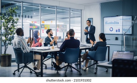 Multi-Ethnic Office Conference Room. Indian CEO does Presentation for Diverse Young Entrepreneurs, Talking, Using TV with Infographics, Statistics, Graphs. Businesspeople Invest in e-Commerce Startup - Shutterstock ID 2101931002