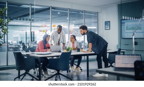 Multi-Ethnic Office Conference Room Meeting: Multicultural Team Of Four Creative Entrepreneurs Talk, Discuss Growth Strategy. Diverse Young Businesspeople Work On Digital E-Commerce Startup.