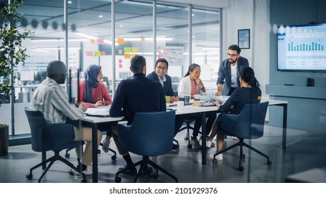 Multi-Ethnic Office Conference Room Meeting: Diverse Team of Young Entrepreneurs, Specialists Talk, Use TV for infographics. Smiling Businesspeople Discuss Investment Strategy in e-commerce Startup - Shutterstock ID 2101929376
