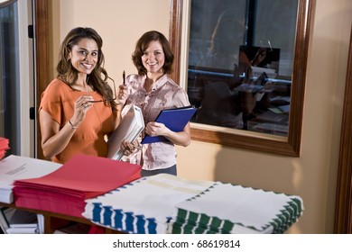 Multiethnic Office Workers Standing In Mailroom