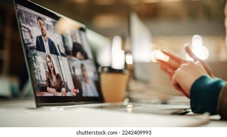 Multiethnic People Conference Meeting Online and Discussing Business Project. Laptop Screen Containing a Group Video Call. Colleagues Working From Home and Collaborating on Internet - Powered by Shutterstock