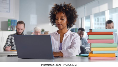 Multiethnic Students Sitting In Classroom Using Laptop. Portrait Of Afro-american Young Woman Studying On Computer In Class Attending Post Graduate Courses