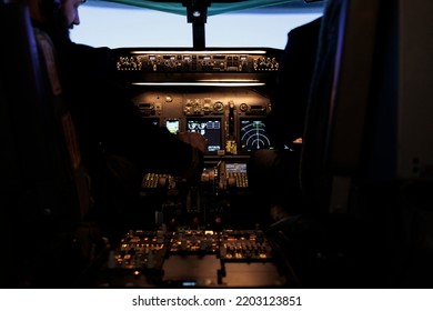 Multiethnic Team Of Captain And Pilot Switching Engine Throttle Lever To Takeoff With Airplane From Aviation Cockpit. Aircrew Men Flying Plane Jet Using Dashboard And Control Panel Command.