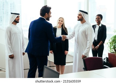 Multiethnic Western And Middle Eastern Business Team Working Together In An Office Of Dubai. Sales People And Employees At Work On New Projects