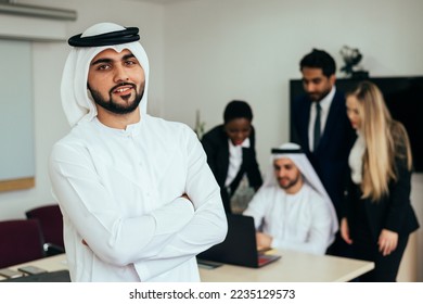 Multiethnic western and middle eastern business team working together in an office of Dubai. Sales people and employees at work on new projects - Shutterstock ID 2235129573