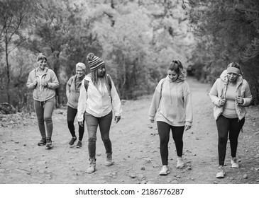 Multiethnic Women Having Fun During Hiking Day In The Mountain Forest - Black And White Editing