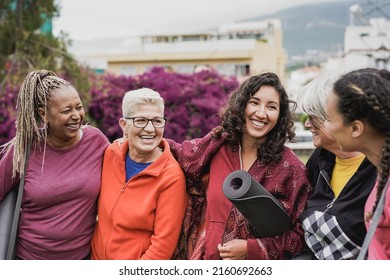 Multiethnic women having fun together after yoga lesson at city park - Powered by Shutterstock