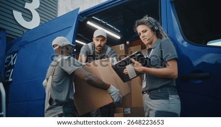 Multiethnic Workers Loading Cardboard Boxes with Online Orders, E-Commerce Goods in Delivery Truck. Female Manager Using Tablet Computer and Barcode Scanner. Outside of Logistics Retail Warehouse.