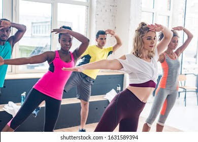 Multiethnic Zumba Dancers Exercising In Dance Studio