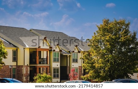 Multifamily building in a Midwestern town, USA; blue sky in background