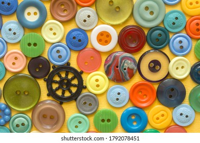 multifarious buttons for clothes on yellow . High quality photo - Shutterstock ID 1792078451