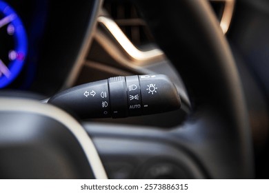 Multifunction controls for car lights, designed for convenience and easy adjustment of headlights, indicators, and other lighting features.