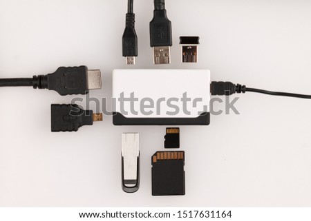 multi-function device external card reader for connecting flash cards and drives, charging cables and an external monitor to a computer