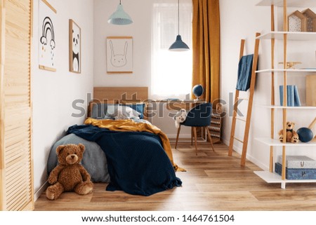 Multifunctional bedroom and workspace interior with bed and desk