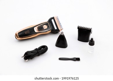 
Multifunctional Gold Razor Trimmer 3 in 1. The electric shaver is equipped with a mesh razor. The shaving head is separated from the face by a mesh. White background. - Shutterstock ID 1991976125