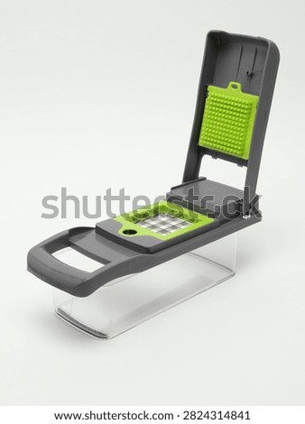Multifunctional Kitchen Vegetable Chopper Dlicer Cutter with Container Isolated on White Background