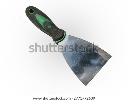 A multifunctional scraper putty knife with an ergonomic black and green handle on white background.