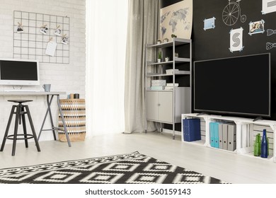 Multifunctional Student Flat With Tv, Pallet Furniture And Brick Wall