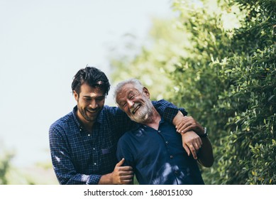 Multi-generation family having fun together outdoors - Powered by Shutterstock