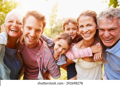 Multi-generation family having fun together outdoors