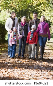 Multi-generation Family On Walk Through Autumn Woods