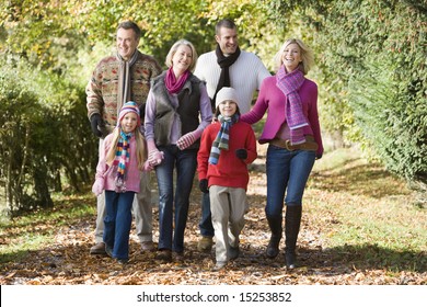 Multi-generation Family On Walk Through Autumn Woods