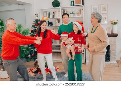 Multigenerational Asian family happily enjoys opening presents on Christmas Eve at home. Family happily  dancing - Powered by Shutterstock