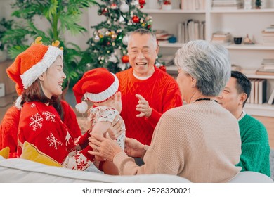 Multigenerational Asian family happily enjoys opening presents on Christmas Eve at home. Family gift asian  - Powered by Shutterstock