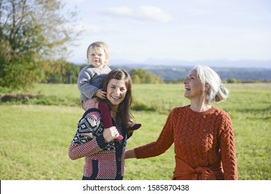 Multigenerational Family Having Fun In Field