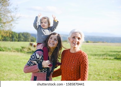 Multigenerational Family Having Fun In Field