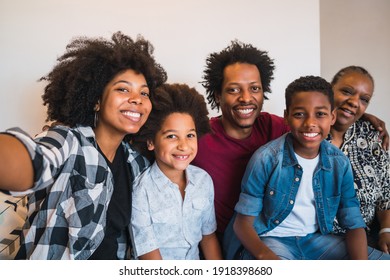 Multigenerational Family Taking Selfie At Home.