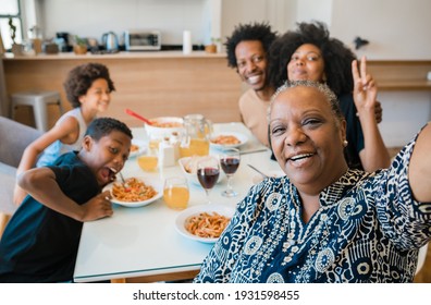 Multigenerational Family Taking Selfie At Home.