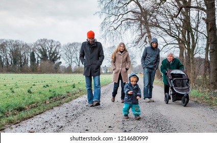 Multi-generational family walking on footpath between fields - Kempen, Germany, Europe