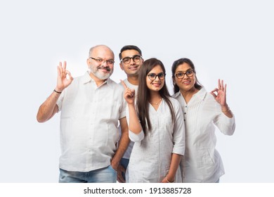 Multigenerational Indian Asian Smart Family Wears Clear Eye Glasses Or Spects Or Spectacles Against White Background